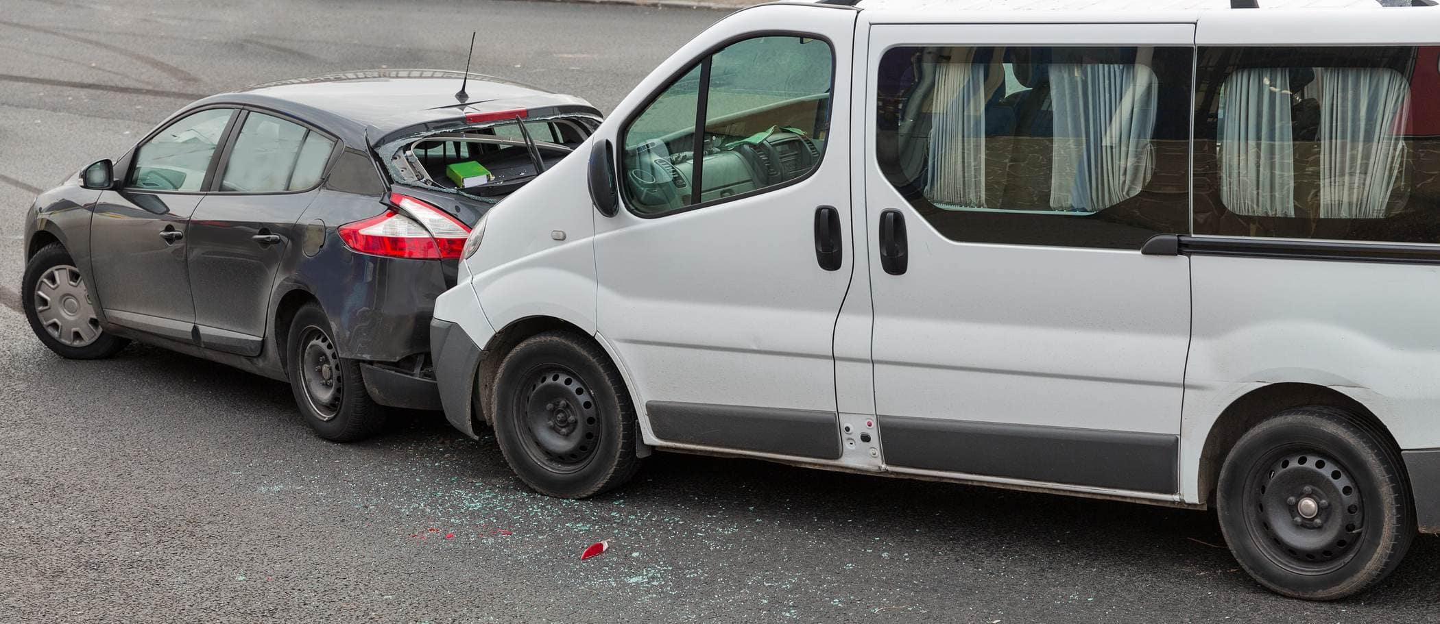 Car and van collision on the road in Australia, vehicle damage.