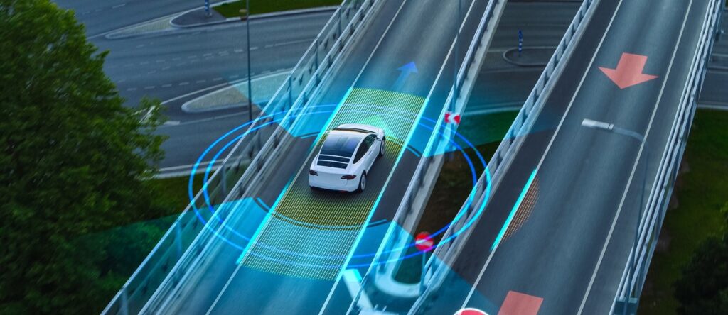 Autonomous vehicle navigating a smart highway with digital traffic signals and sensors.