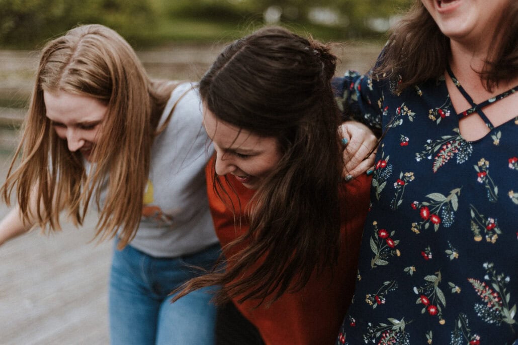 young women mental health leaning on each other