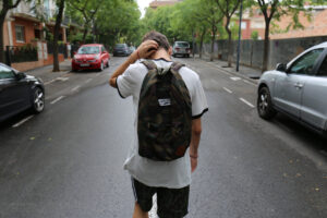 young man walking stressed about life stage