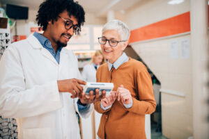 pharmacist discussing medication with customer