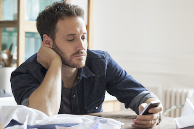 man looking at phone