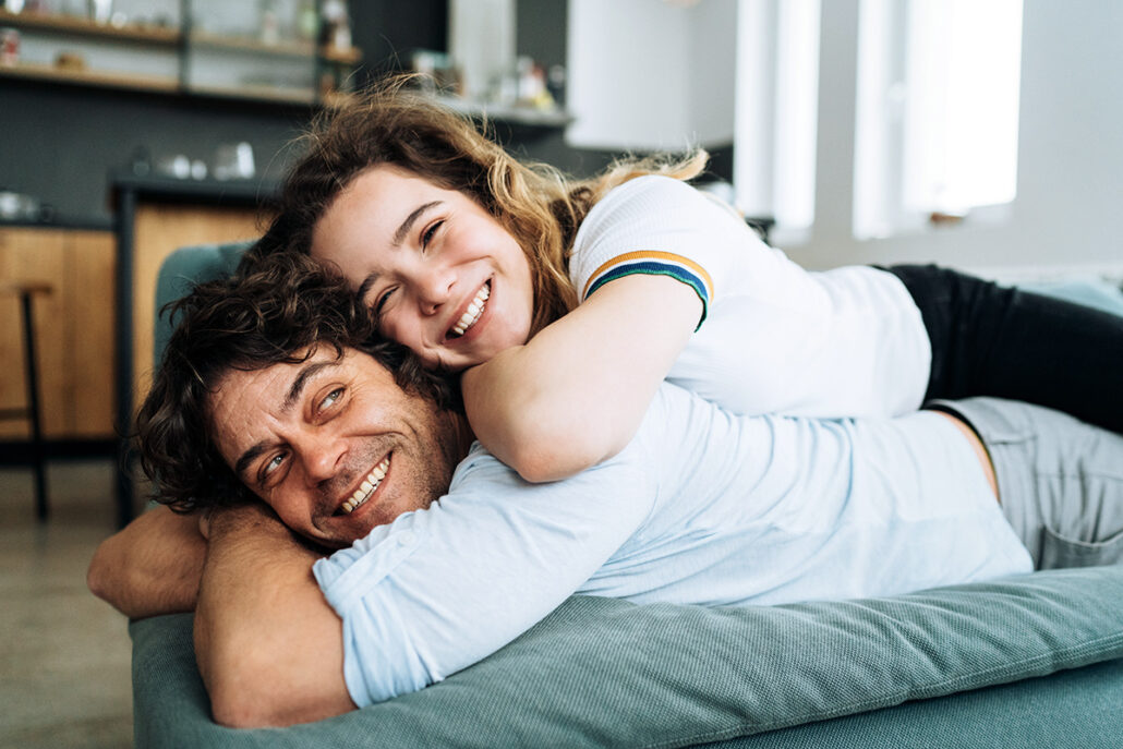 daughter lying on top of father