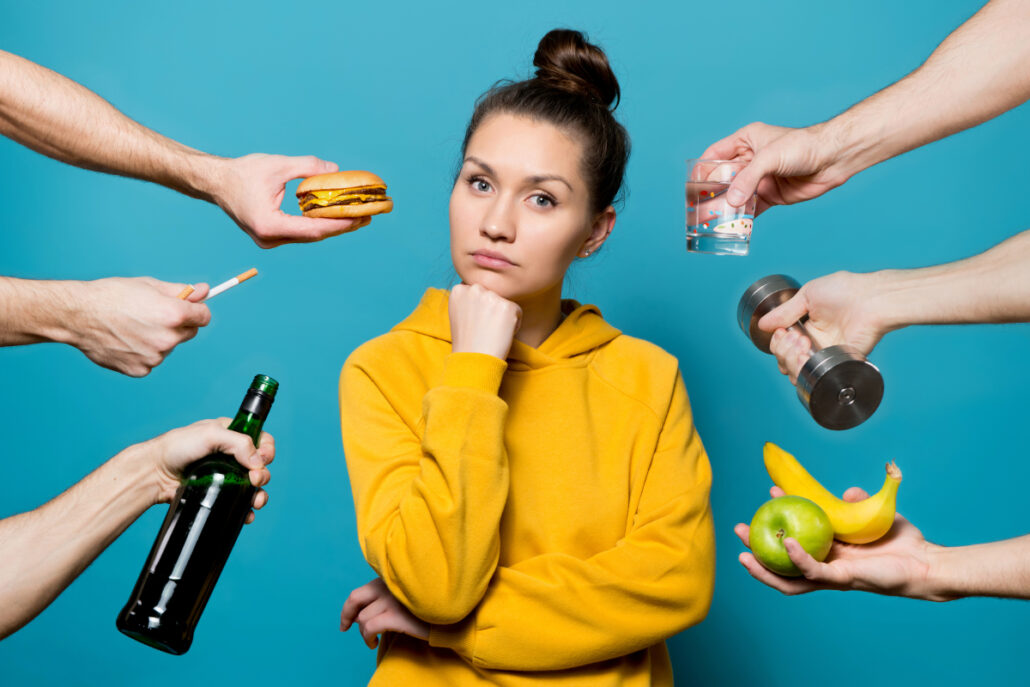 girl being offered cheeseburger, alcohol, fruit, water, cigarettes, and weights