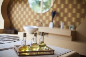 three bottles of oil sitting on table