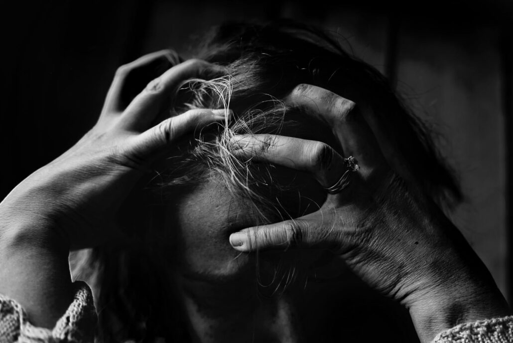 woman with hands in hair