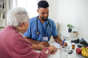 nurse administering medications to elderly woman patient for risk stratification definition