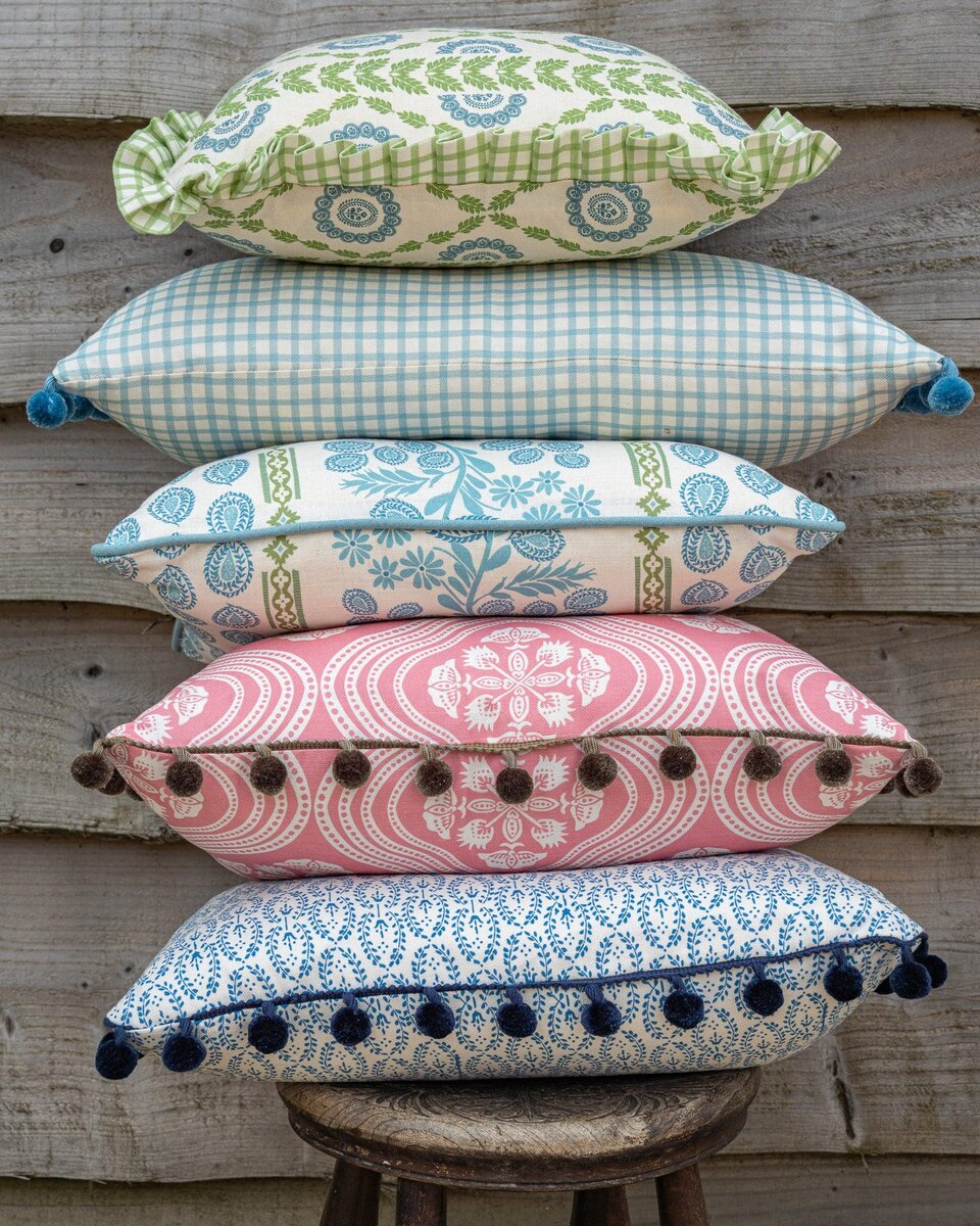 stack of coloured cushions made by Charlotte Gaisford Designer