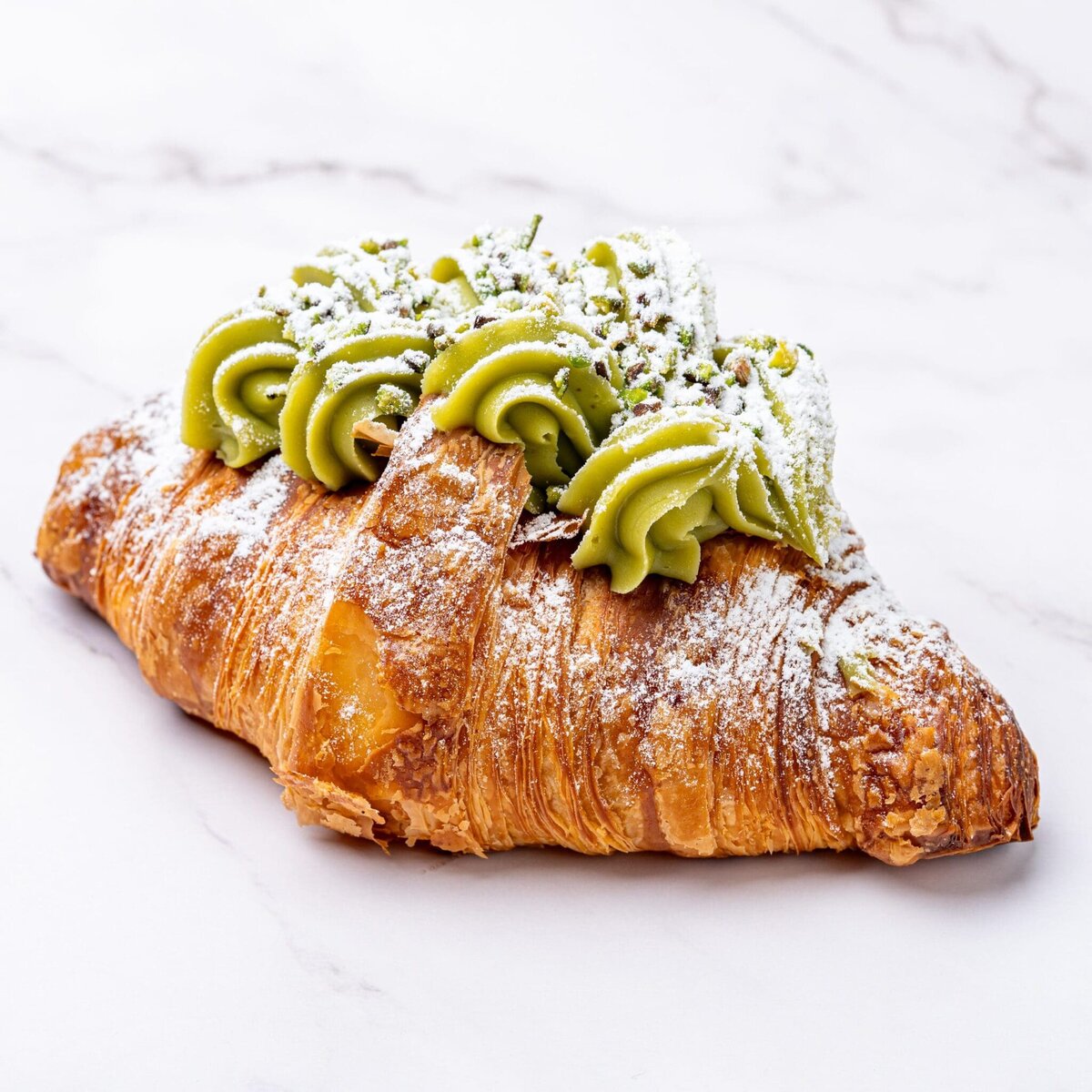 Pistachio croissant photographed by Georgie Greene