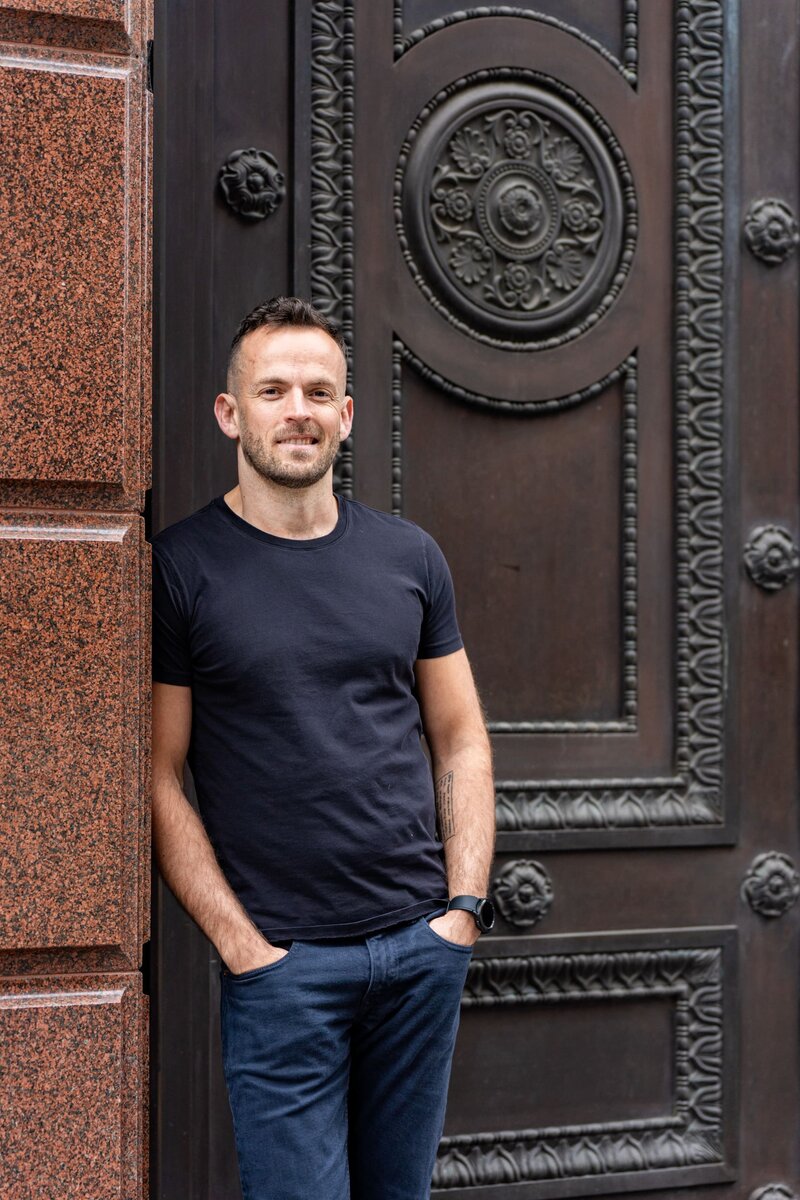 Ext: Young man wearing a black having dating app photography taken by dating photographer Georgie Greene in Sydney NSW