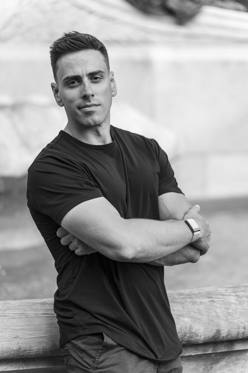 Ext: Young man in a black shirt having his Sydney headshots taken by professional photographer Georgie Greene in Sydney NSW