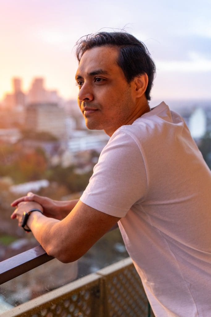 Eye-Catching-Dating-App-Photo-Sydney-NSW – Professional Photographer Sydney Ext: Young Indian man at sunset having an eye-catching dating portrait taken by dating photographer Georgie Greene in Sydney NSW