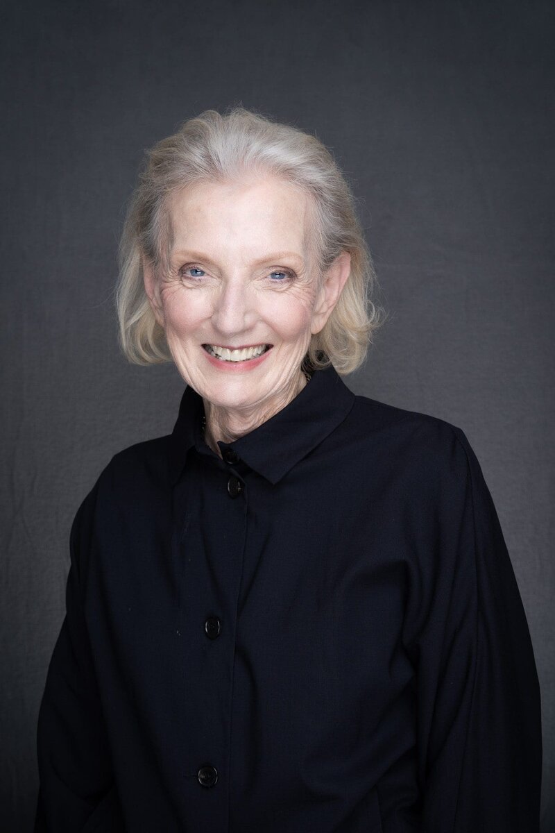 Journalist Helen Trinca wearing a black coat having her headshot taken by headshot photographer Georgie Greene in Sydney NSW