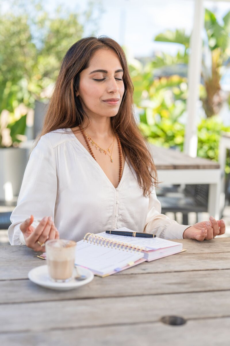Int: Holistic Brand Strategist wearing a cream top having personal branding photos taken by photographer Georgie Greene in Sydney NSW