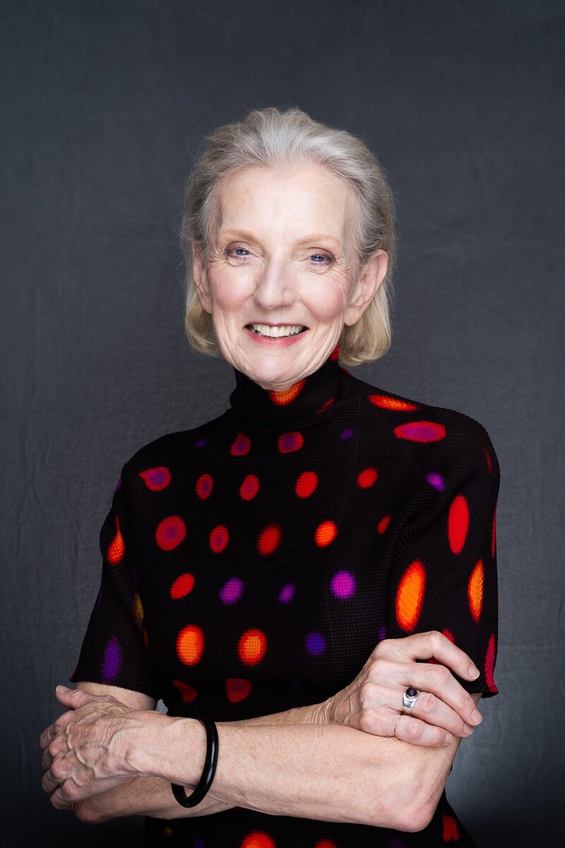 Journalist Helen Trinca wearing a spotty top having her professional headshot taken by headshots photographer Georgie Greene in Sydney NSW