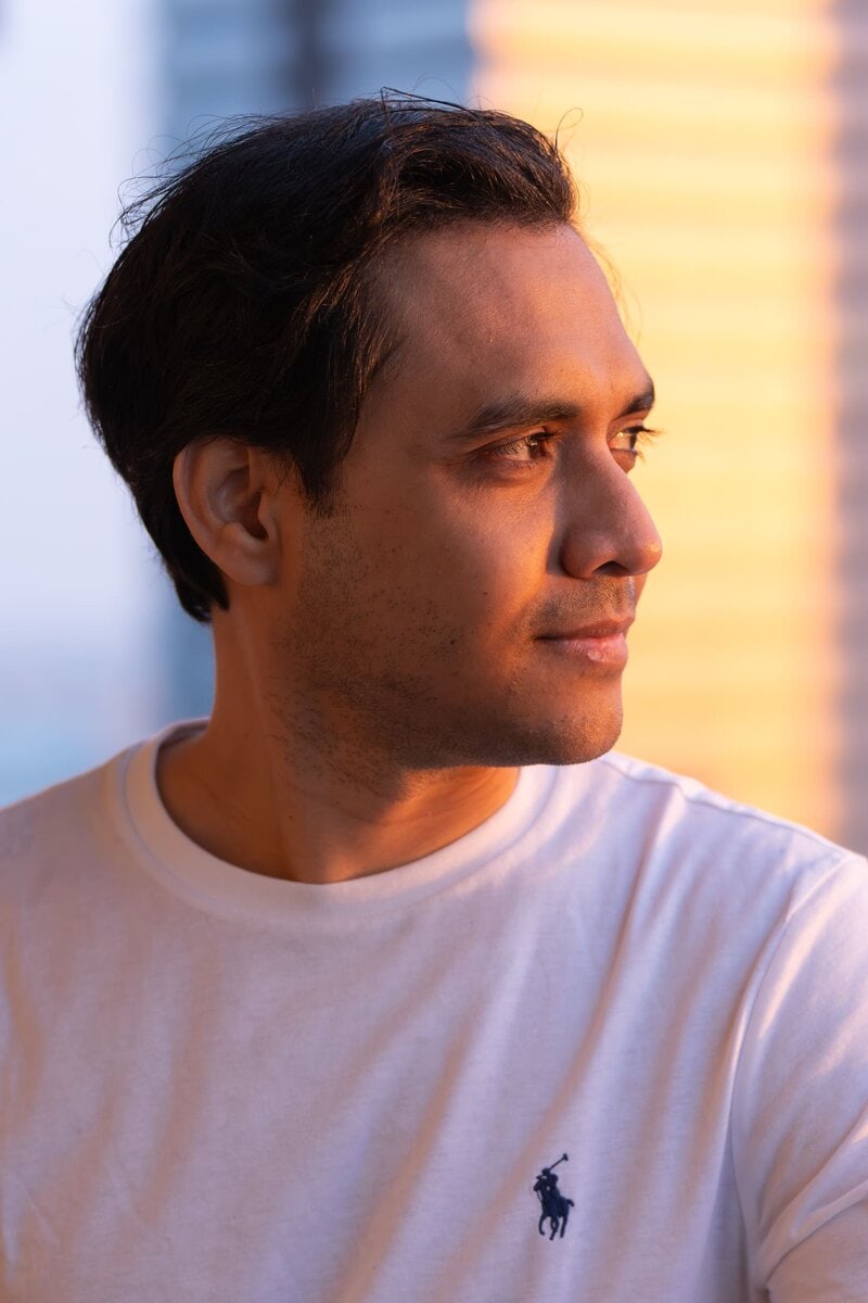 Ext: Young Indian man wearing white having a magnetic dating app photo taken by professional photographer Georgie Greene in Sydney NSW