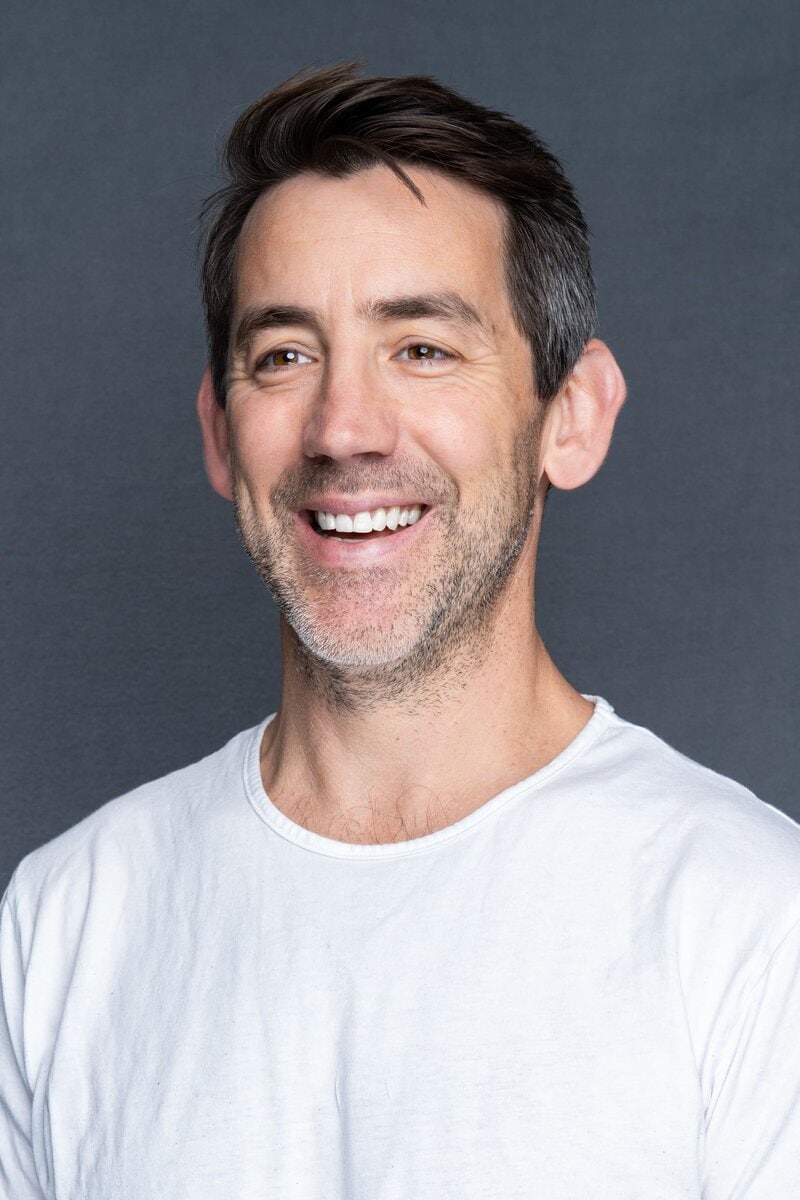 Int: man with dark hair in a white t-shirt having a head shot taken by Sydney Headshot Photographer Georgie Greene in Sydney NSW