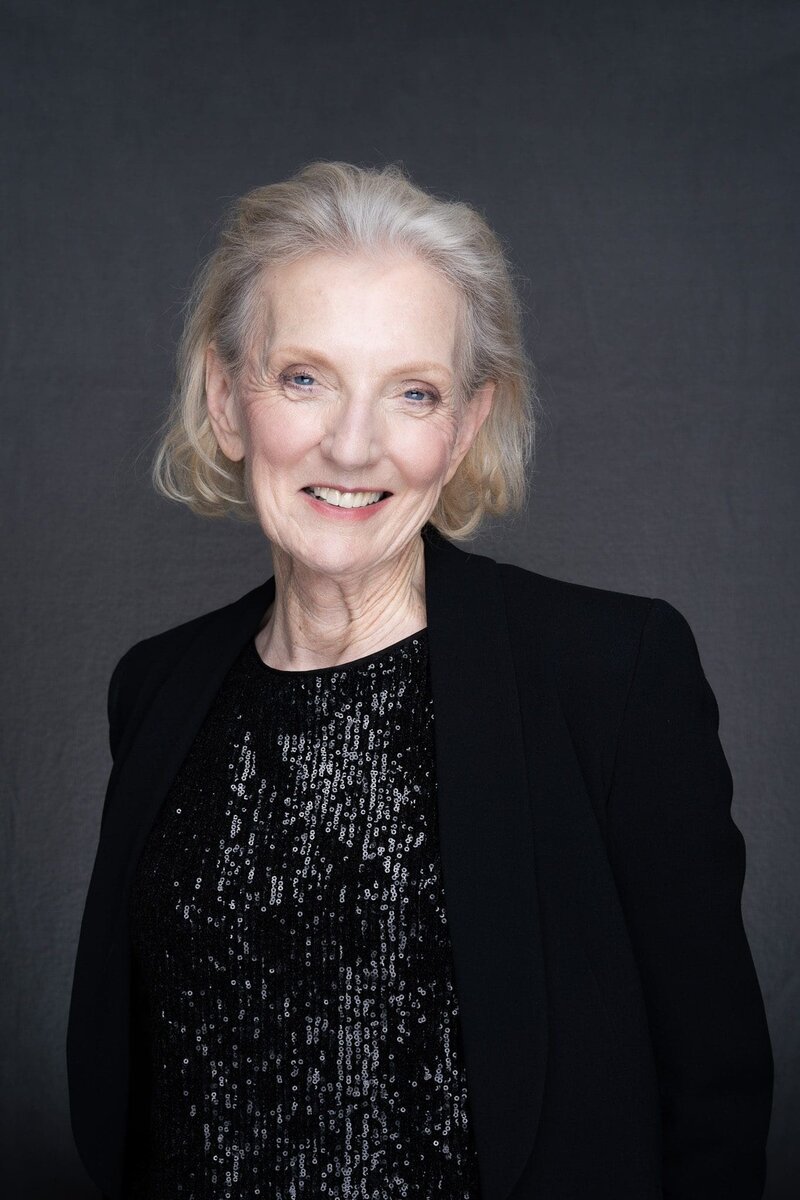 Journalist Helen Trinca wearing a black jacket having her corporate headshot taken by Sydney photographer Georgie Greene in Sydney NSW