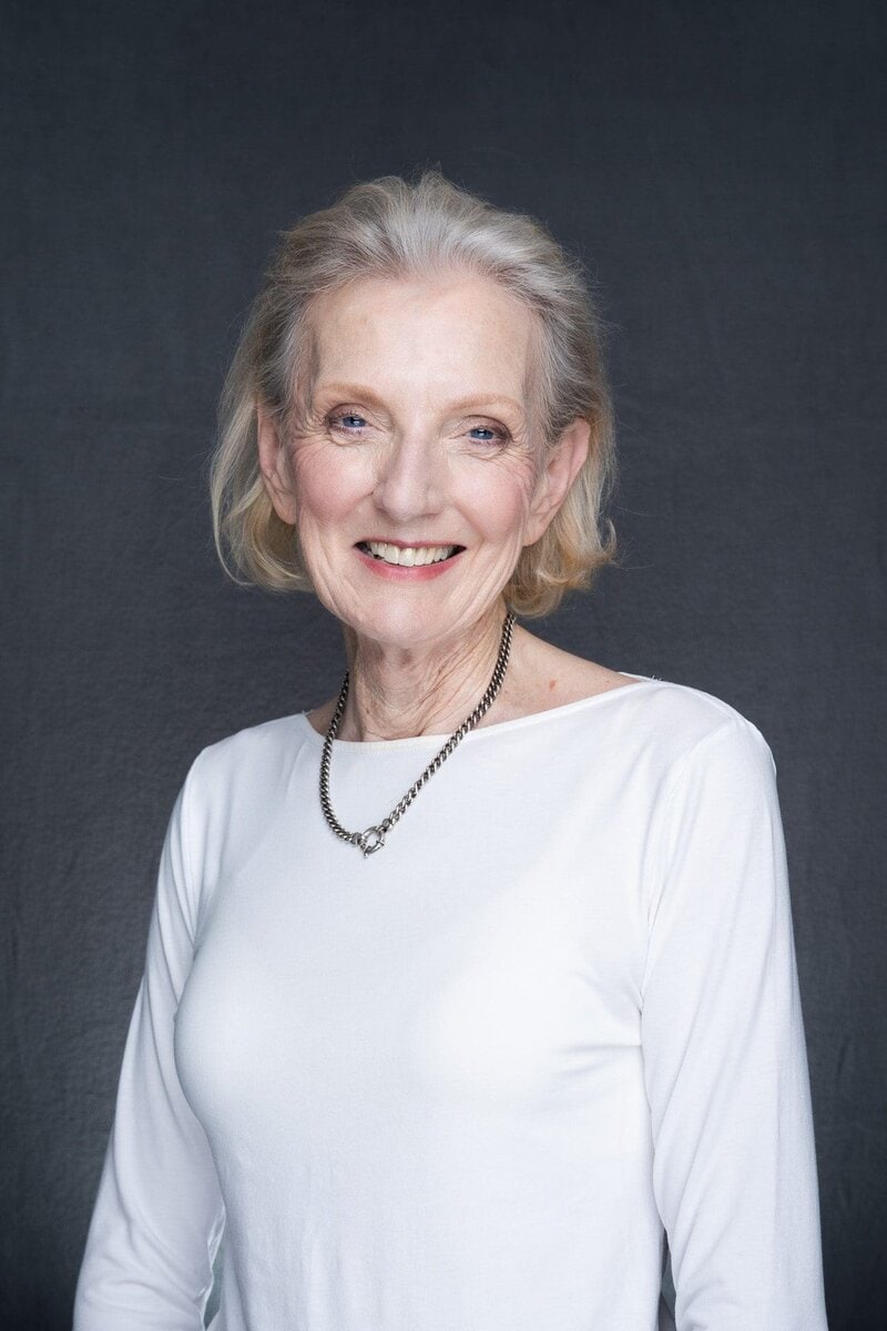 Journalist Helen Trinca wearing a white top having her LinkedIn headshot taken by headshot photographer Georgie Greene in Sydney NSW