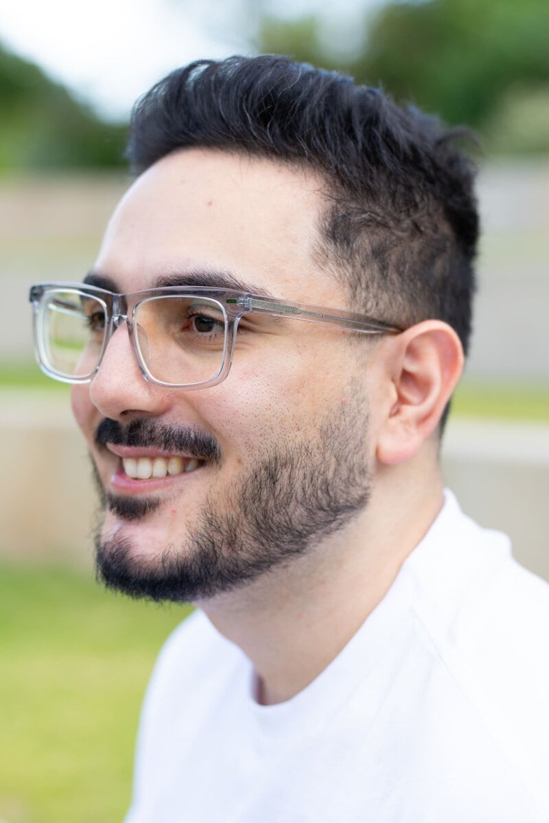 Ext: Young man wearing white having an outdoor dating app photo taken by professional photographer Georgie Greene in Sydney NSW