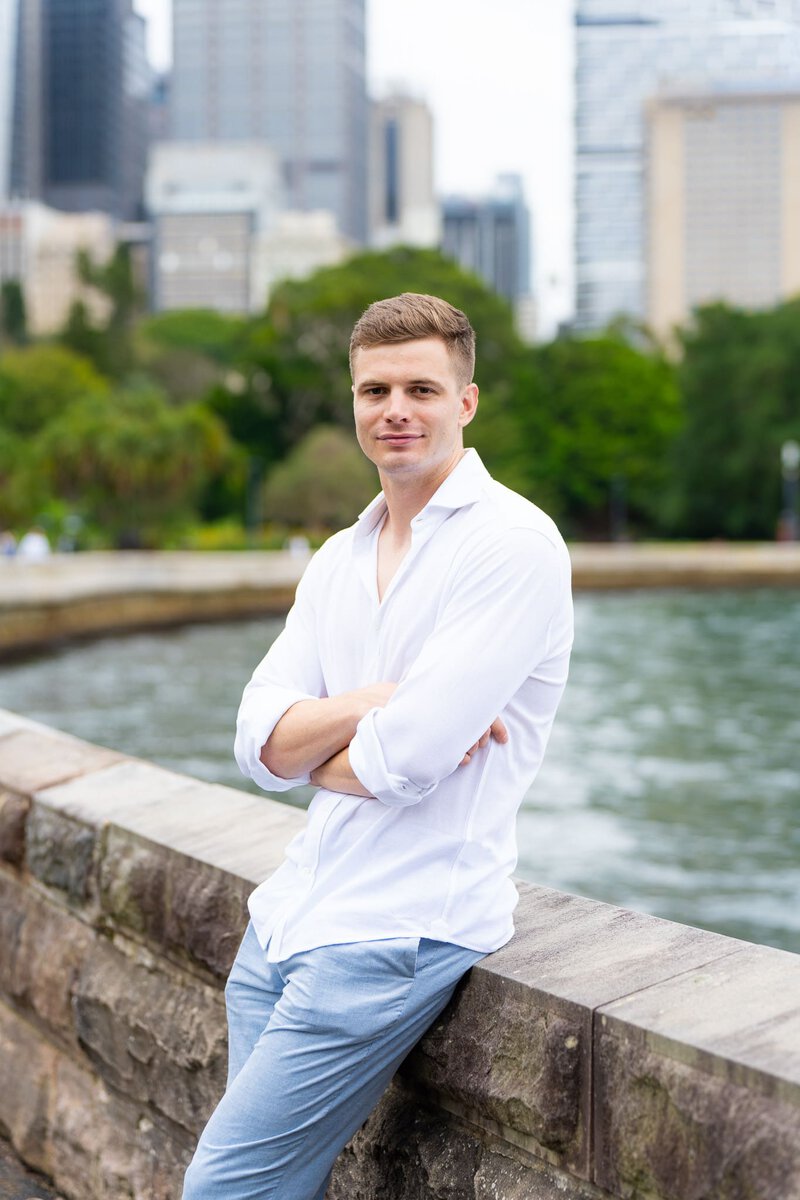 Ext: Young man wearing white shirt having a dating app photo taken by professional photographer Georgie Greene in Sydney NSW
