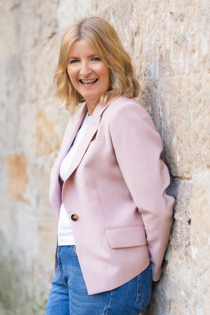 Ext: Executive Coach standing by a wall having her personal branding taken by Georgie Greene Photography in Sydney NSW