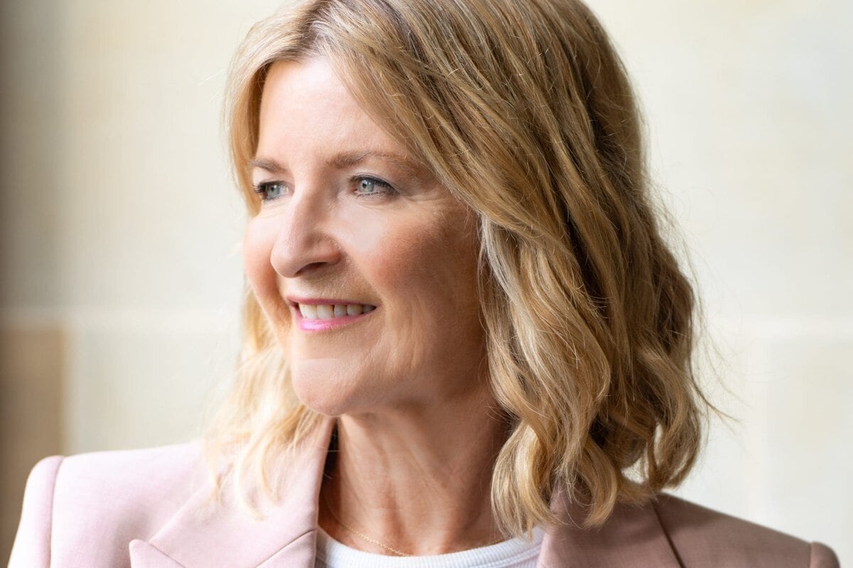 Ext: Executive Coach wearing pink having her personal branding headshot taken by professional photographer Georgie Greene in Sydney NSW