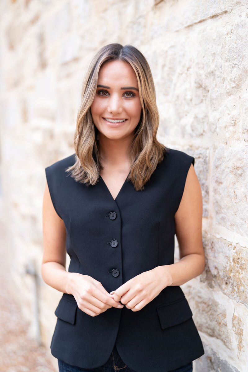 Young blonde journalist wearing a black top having her headshot taken by Sydney headshot photographer Georgie Greene