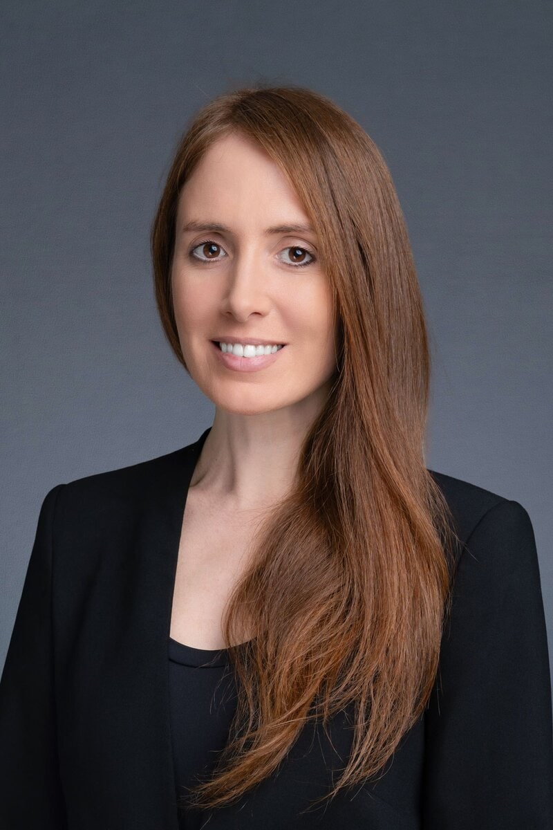 Int: young woman with long red hair having Business head shots taken by headshot photographer Georgie Greene in Sydney NSW