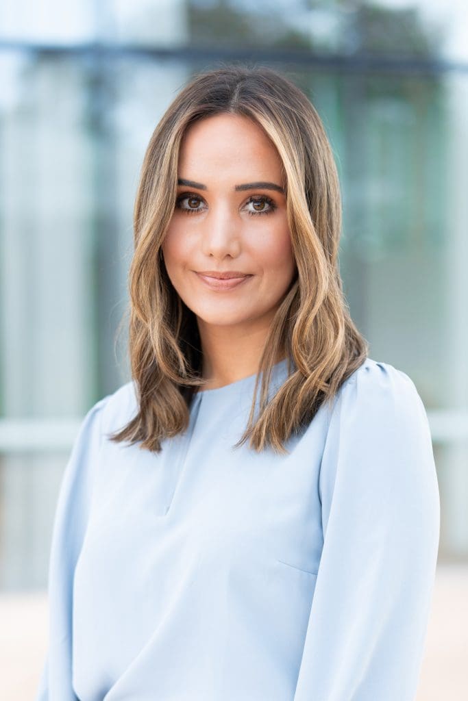 Young blonde journalist wearing a blue top having her headshot taken by Sydney headshot photographer Georgie Greene