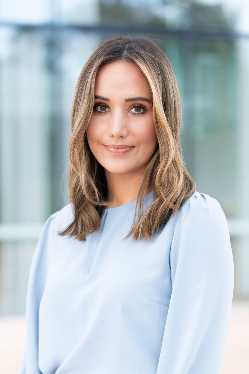Young blonde journalist wearing a blue top having her headshot taken by Sydney headshot photographer Georgie Greene
