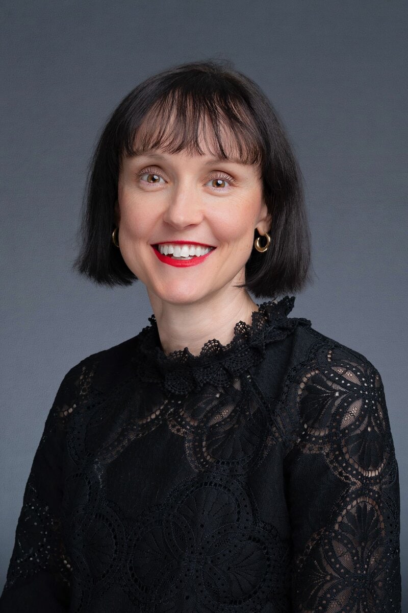 Older woman wearing a black shirt having corporate headshots taken by Sydney Photographer Georgie Greene in Sydney NSW