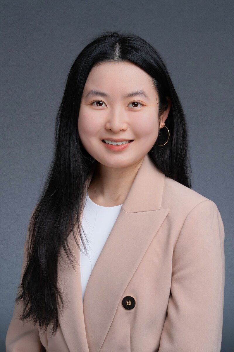 Young asian woman in pink having a professional headshot taken by professional photographer Georgie Greene in Sydney NSW