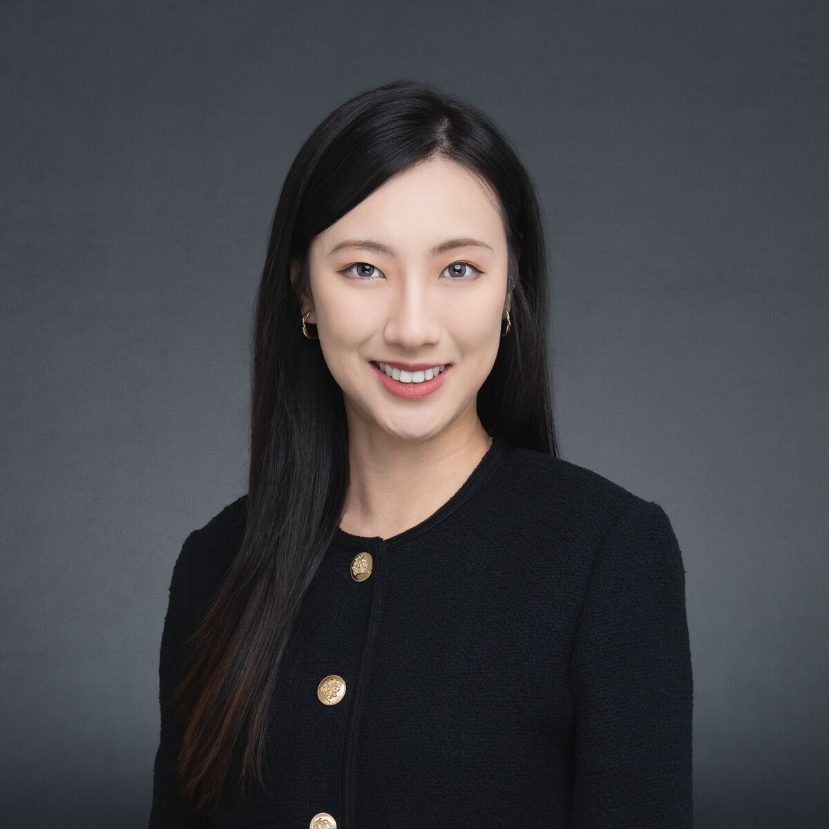 Japanese Sydney Female Lawyer wearing black and having her professional headshot taken by Sydney headshot photographer Georgie Greene