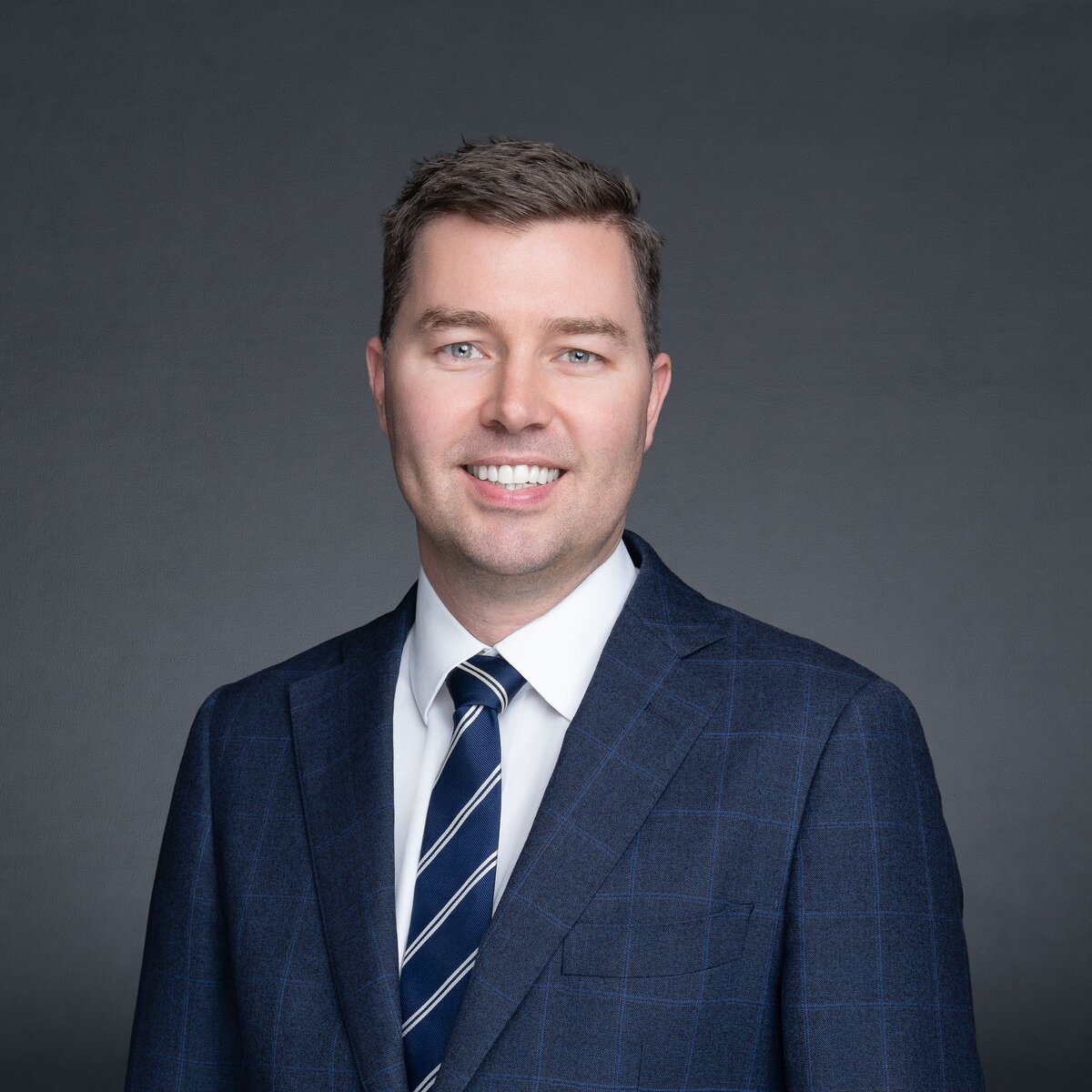 Male Lawyer wearing blue and having his business headshot taken by Sydney headshot photographer Georgie Greene