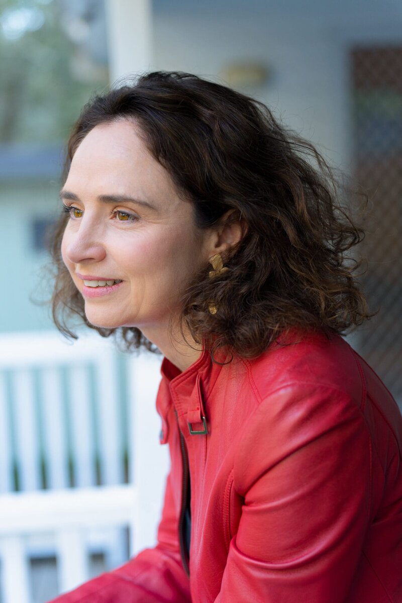 Author-Headshot-Sydney-NSW – Professional Photographer Sydney Young woman wearing a red leather jacket having her portrait taken by Sydney portrait photographer Georgie Greene