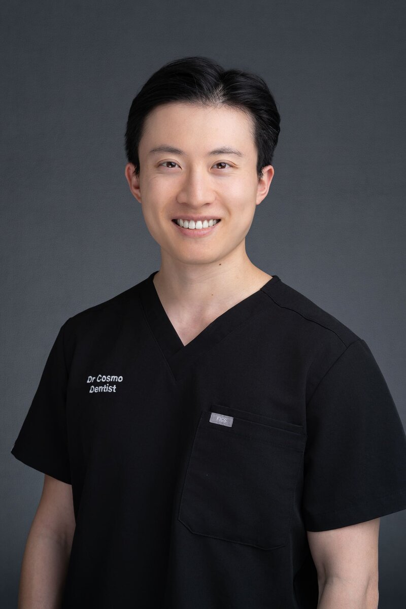 Young Asian Dentist wearing his medical scrubs having his headshot taken by Sydney headshot photographer Georgie Greene