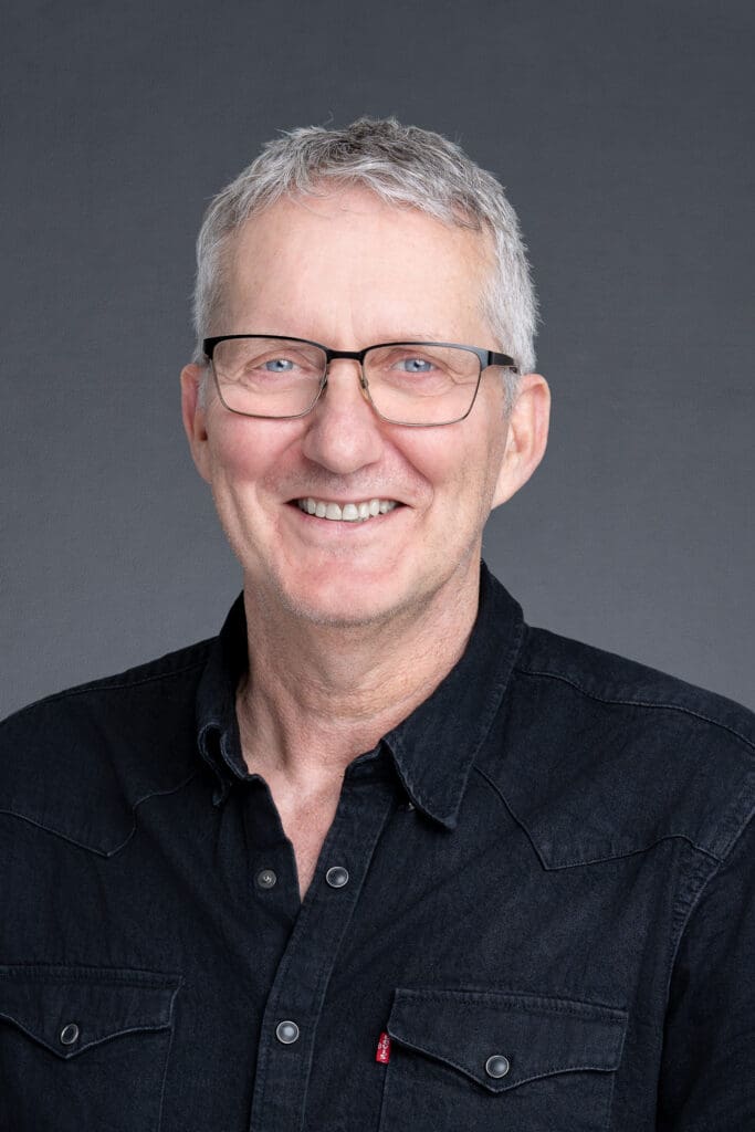 Leadership-Headshot-Sydney-NSW – Professional Photographer Sydney Middle-aged man wearing a black shirt having his headshot taken by Sydney portrait photographer Georgie Greene