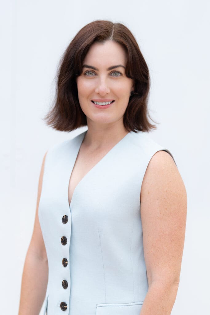 Sydney-Job-Hunter-NSW – Professional Photographer Sydney Young dark haired woman wearing a blue top having her portrait taken by Sydney headshot photographer Georgie Greene