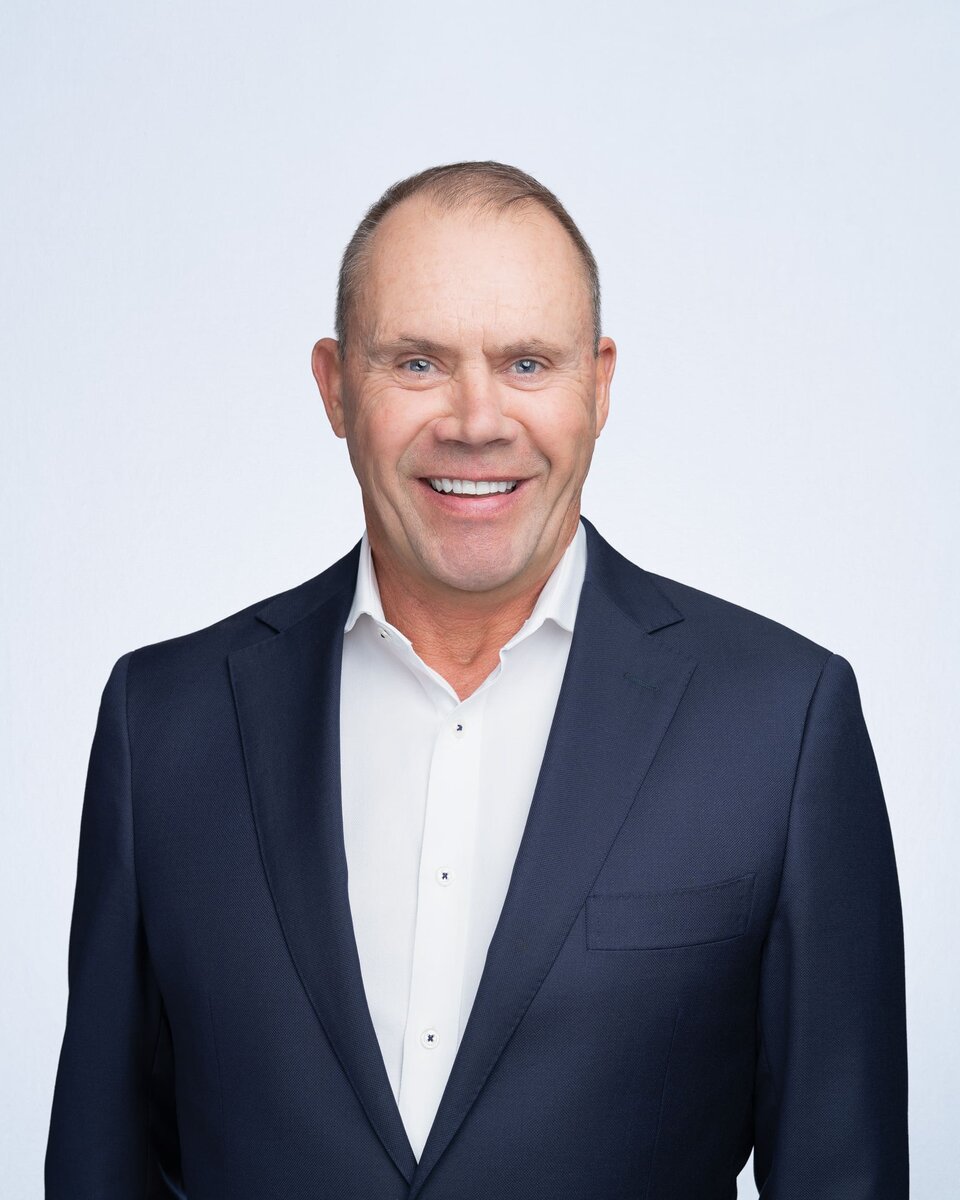 Older man wearing a blue jacket having his company headshot taken by Sydney headshot photographer Georgie Greene
