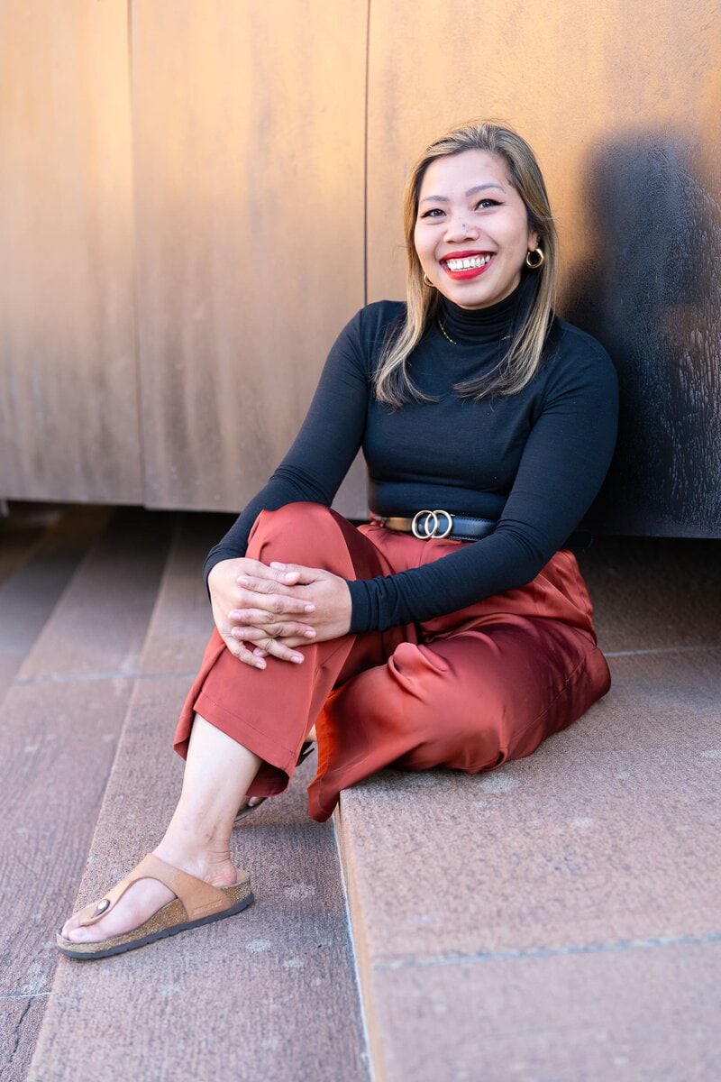 Indonesian business woman wearing orange pants having her personal branding portrait taken by Sydney professional portrait photographer Georgie Greene