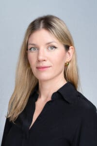 Young woman with blonde hair in a black shirt having her headshot taken by Sydney professional photographer Georgie Greene