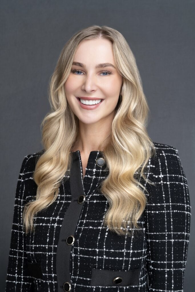 Sydney headshot of young blonde woman wearing a checked jacket