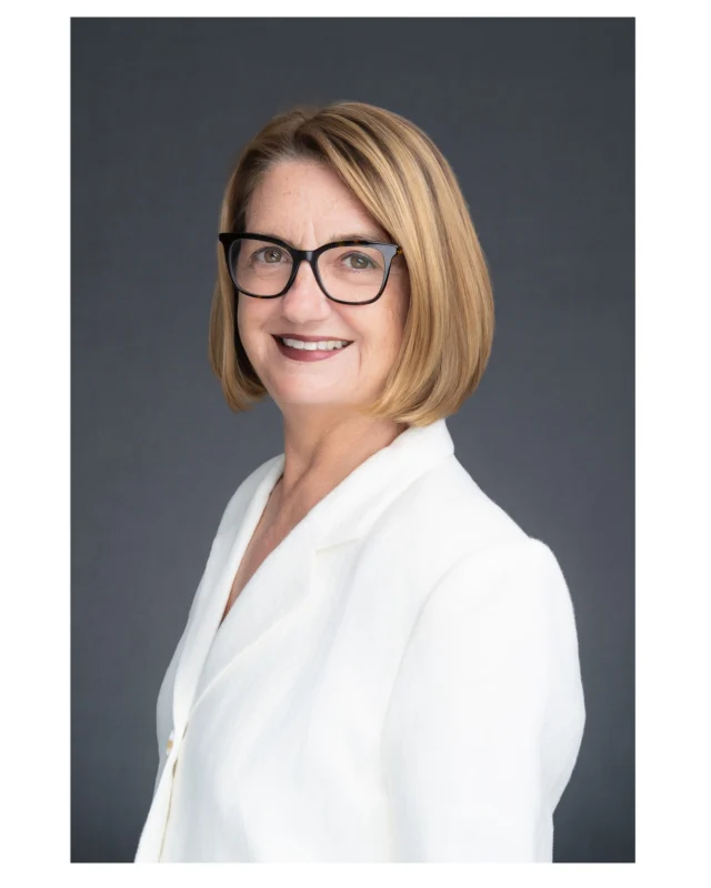 A lovely white jacket is great, as the light reflects off it, adding to the flattering soft light in the headshot.