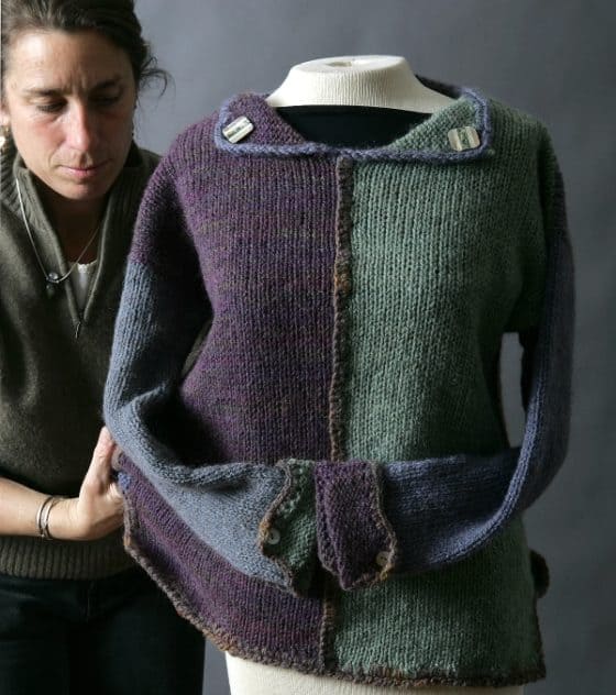 Vibrant Seacolors Yarnery multicolor knitted sweater displayed on a mannequin, showcasing eco-friendly, hand-dyed yarns for sustainable fashion and unique knitted apparel.