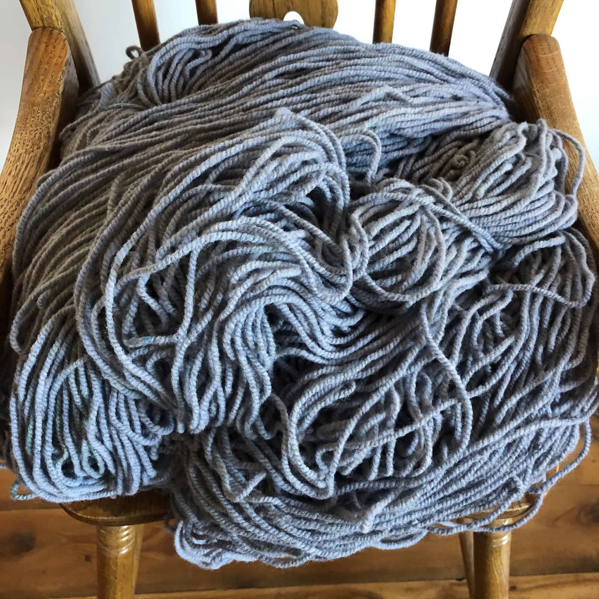 Soft gray yarn from Seacolors Yarnery, perfect for knitting or crocheting cozy garments and accessories. High-quality wool for vibrant, durable handmade projects.