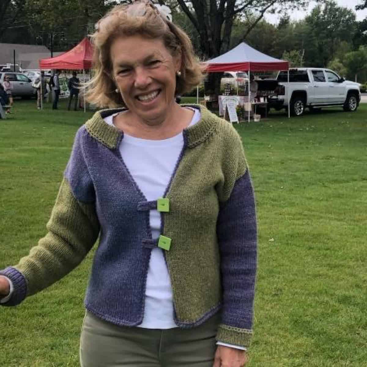 Soft, colorful Seacolors Yarnery crochet cardigan featuring vibrant green, purple, and gray hues, perfect for knitting enthusiasts seeking unique, high-quality yarn for custom handmade sweater projects.