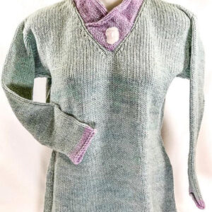 Luxurious hand-knit sweater featuring Seacolors Yarnery yarns with soft pastel green and pink accents, expertly crafted for a cozy and stylish look. Perfect for fall and winter wear.