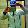 Abdulahi Malak takes a selfie in a mirror wearing a blue baseball cap and jacket. – Ghar.ie property listing