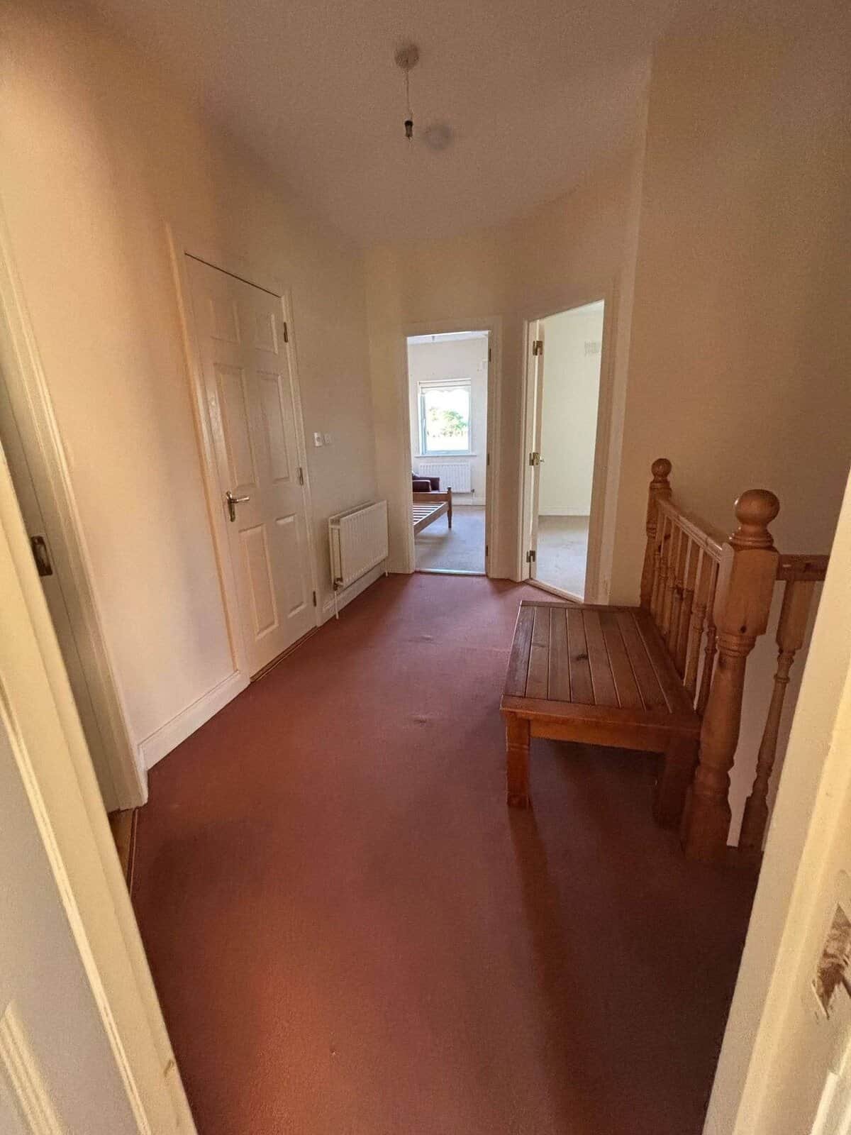 Hallway with a wooden bench in this bright 3 bed Mullingar property. – Ghar.ie property listing